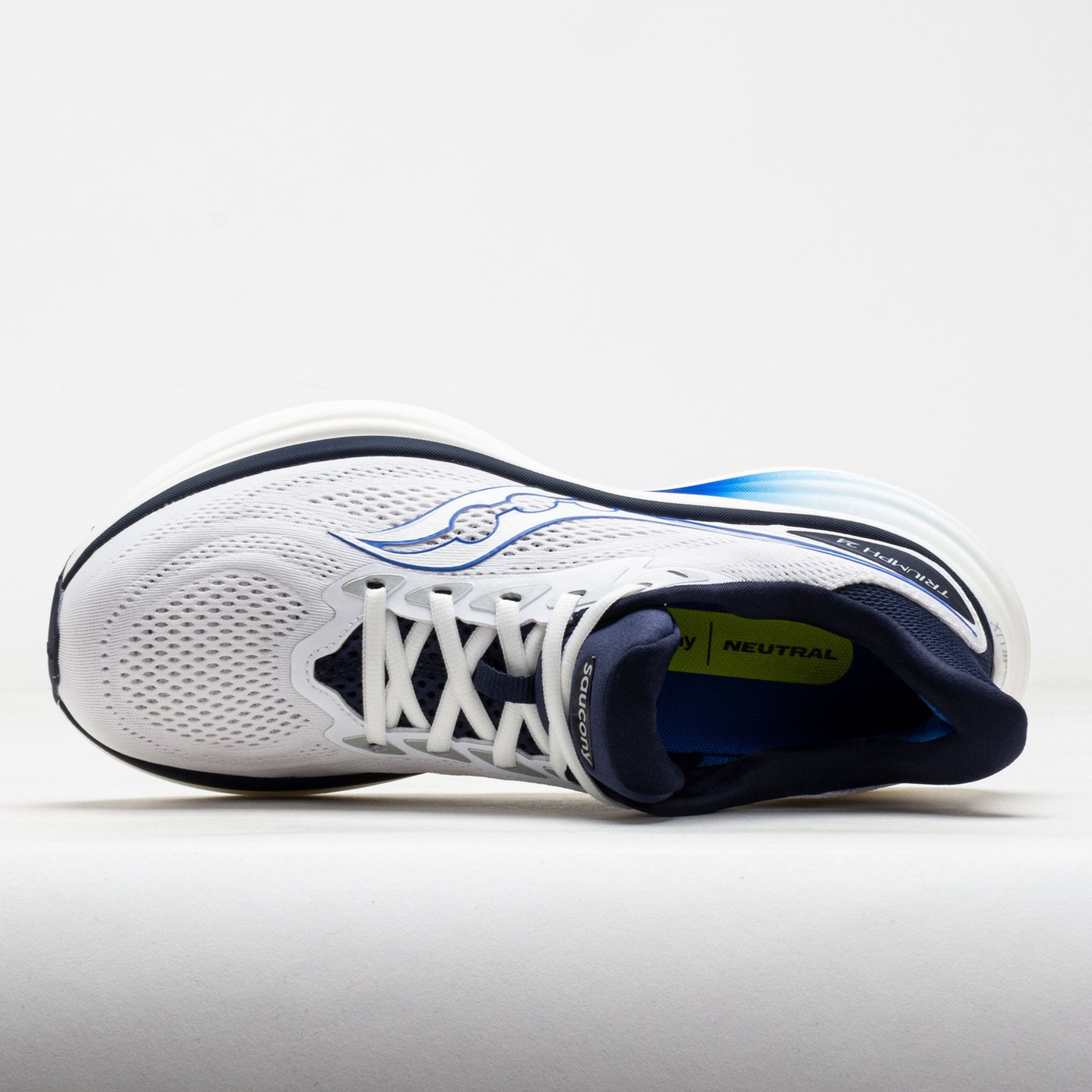 Saucony Triumph 24 blanc/naval : vue de profil, mettant en valeur le stack IncrediLUX et la semelle XT-900